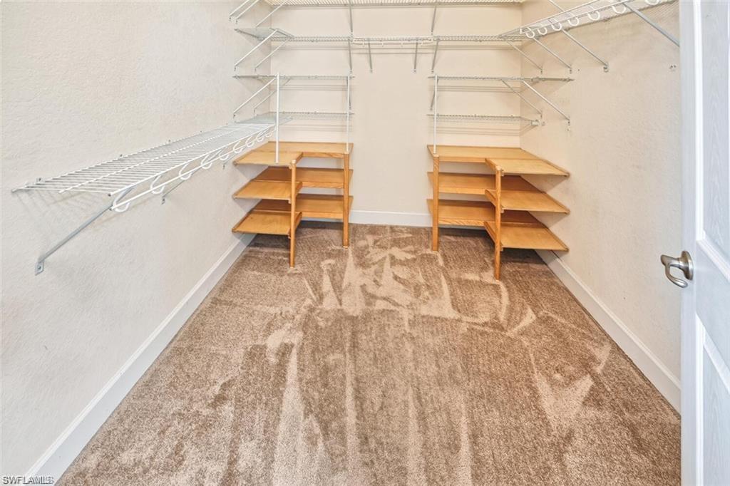 20437 Ardore Lane Estero, FL 33928 - Photo 19 of 36 a view of entryway with wooden floor