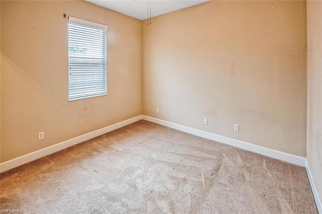 20437 Ardore Lane Estero, FL 33928 - Photo 20 of 36 an empty room with a window