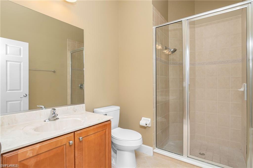 20437 Ardore Lane Estero, FL 33928 - Photo 25 of 36 a bathroom with a sink a toilet and shower