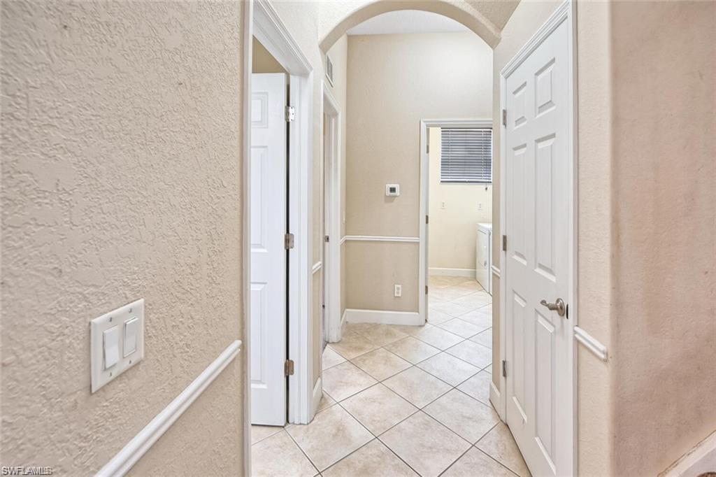 20437 Ardore Lane Estero, FL 33928 - Photo 7 of 36 a bathroom with a tub and a shower