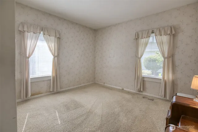 a bathroom with a double vanity sink mirror and shower