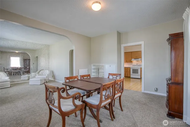a dining room with furniture and window