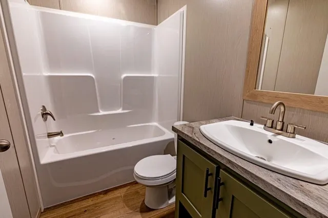 a bathroom with a sink a toilet and a bathtub