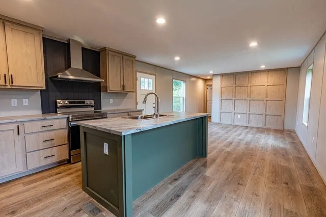 a kitchen with cabinets a sink and appliances