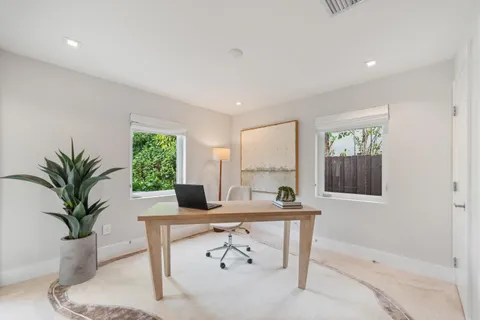 a workspace with furniture and window