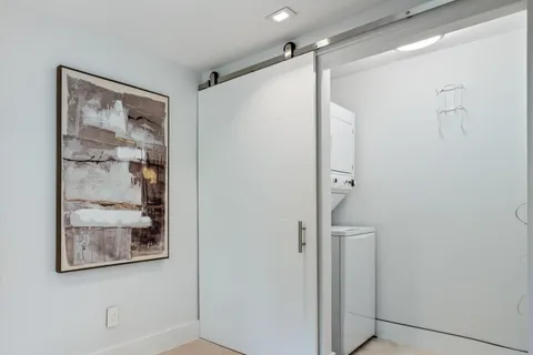 a bathroom with a shower and a sink