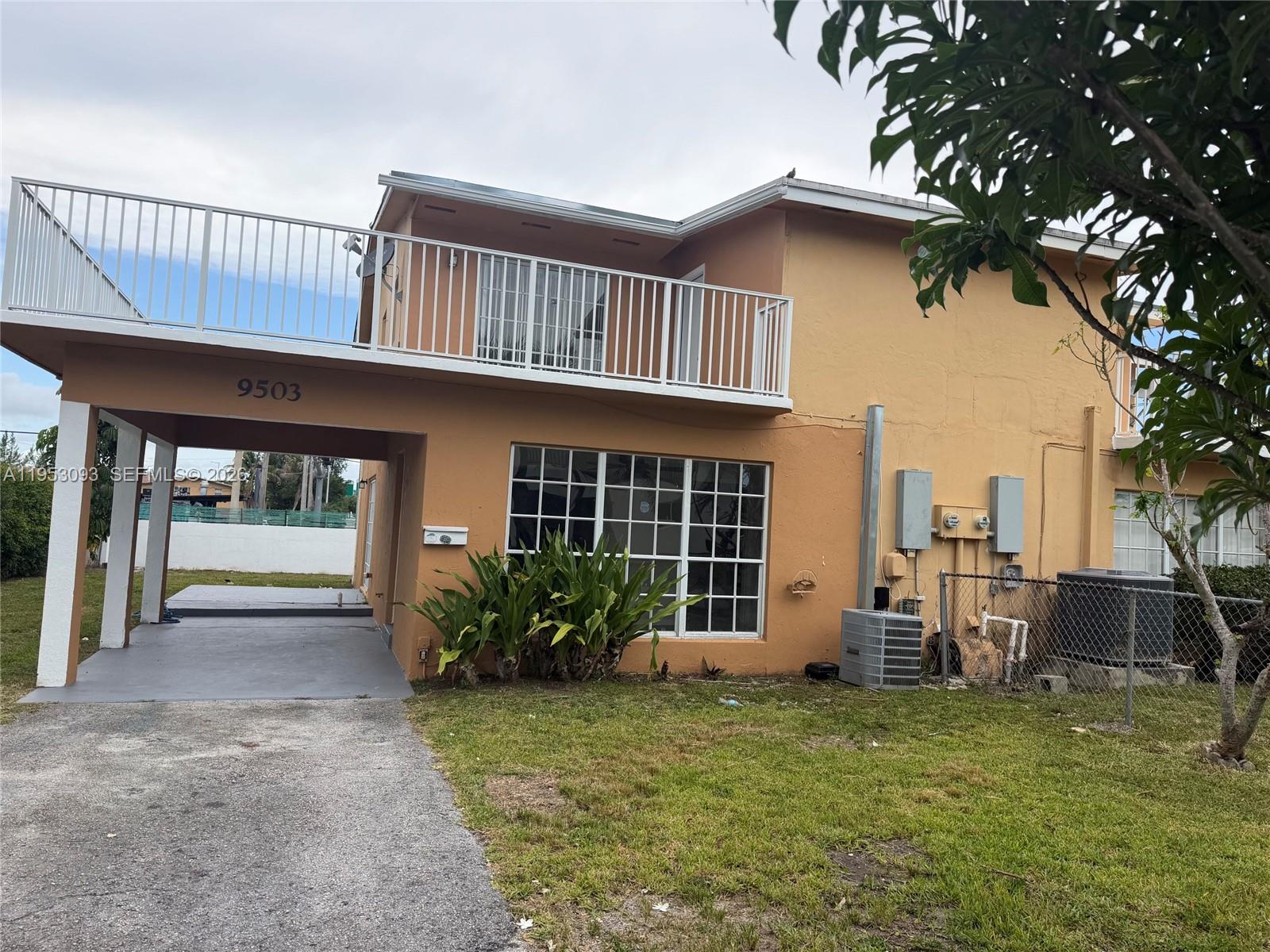 9503 Southwest 88th Terrace, Unit 9503 Miami, FL 33176 - Photo 1 of 15 a view of a house with a yard and plants