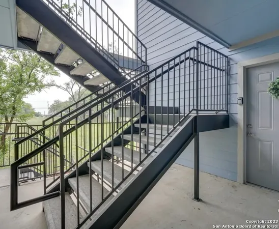 a view of brick building with many windows
