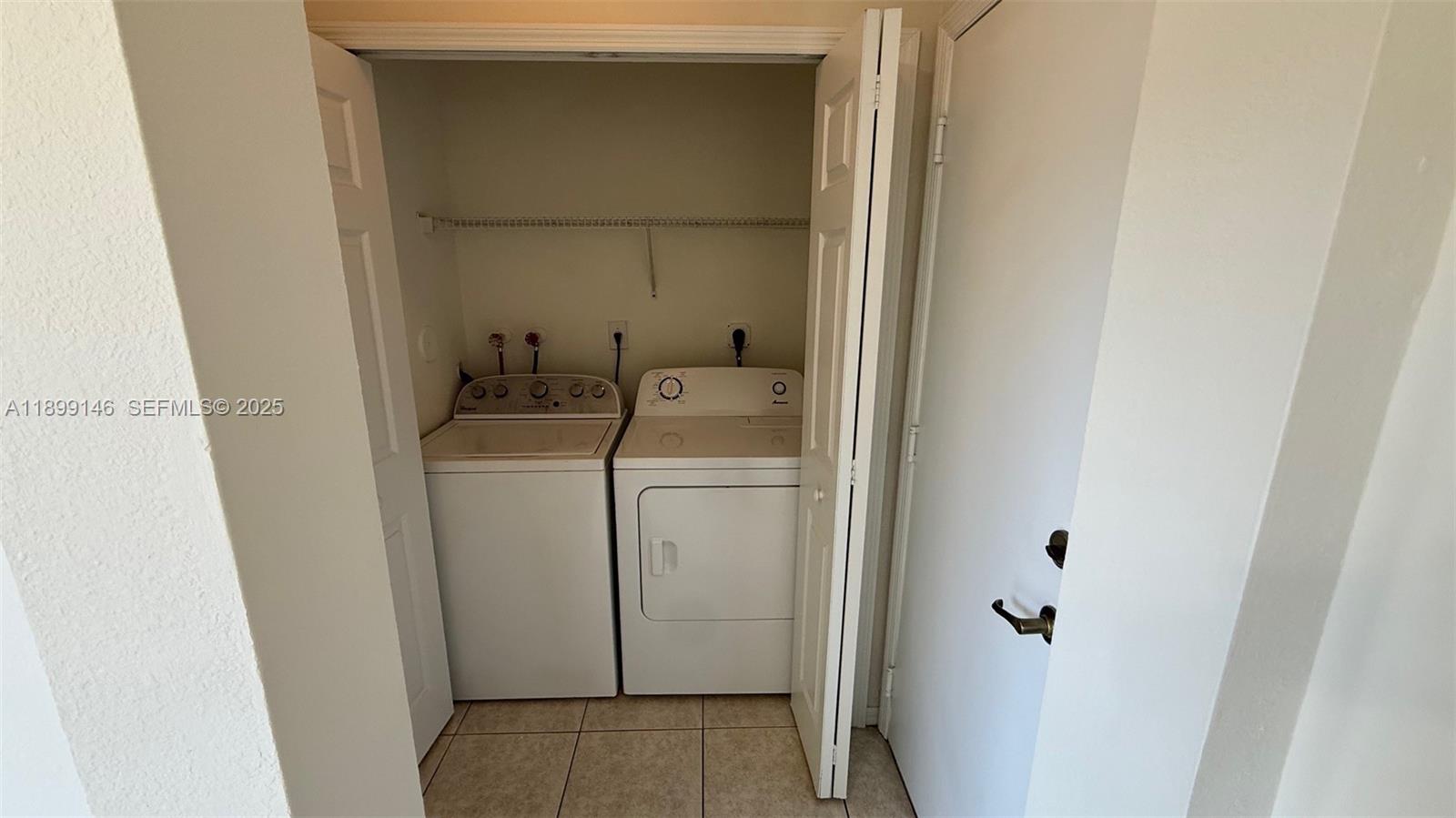 13810 Southwest 276th Street, Unit 13810 Homestead, FL 33032 - Photo 16 of 38 a utility room with dryer and washer