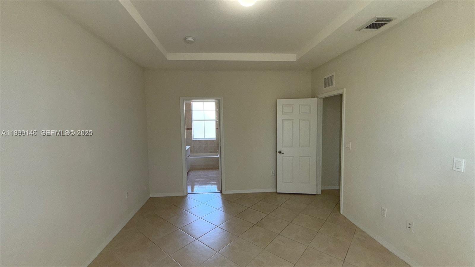 13810 Southwest 276th Street, Unit 13810 Homestead, FL 33032 - Photo 19 of 38 a view of an empty room