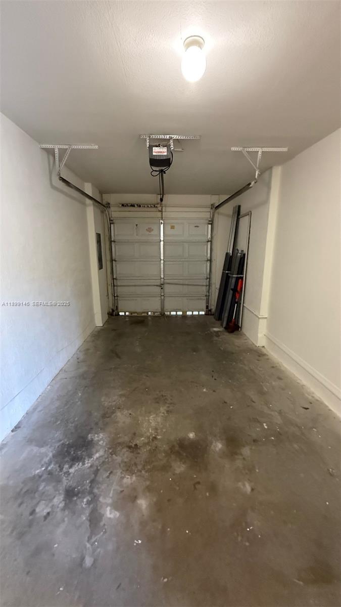 13810 Southwest 276th Street, Unit 13810 Homestead, FL 33032 - Photo 33 of 38 a view of a garage