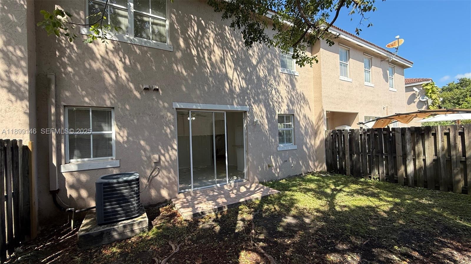 13810 Southwest 276th Street, Unit 13810 Homestead, FL 33032 - Photo 34 of 38 a backyard of a house