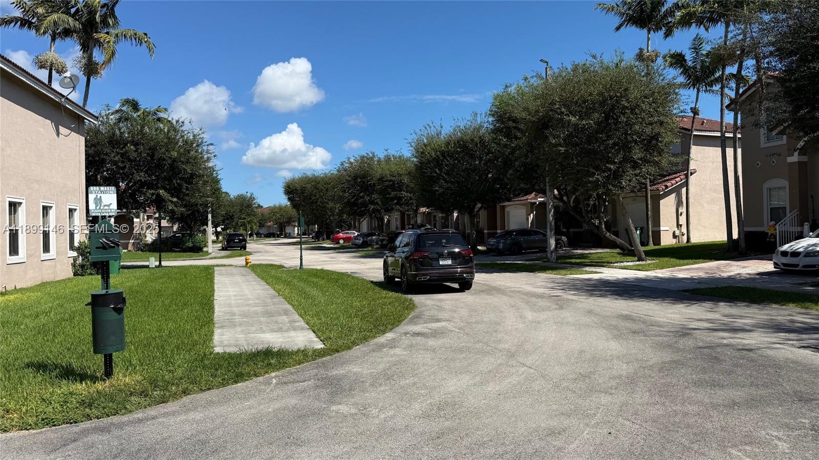 13810 Southwest 276th Street, Unit 13810 Homestead, FL 33032 - Photo 38 of 38 a view of a street with houses
