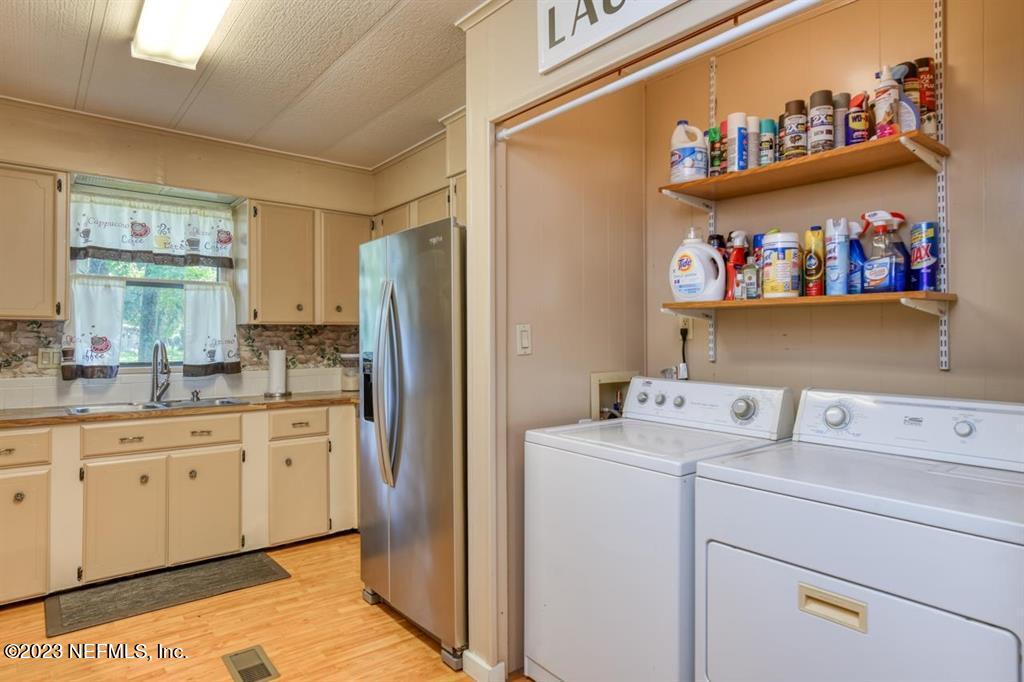 2221 Twin Fox Trail St. Augustine, FL 32086 - Photo 15 of 36 a utility room with dryer and washer