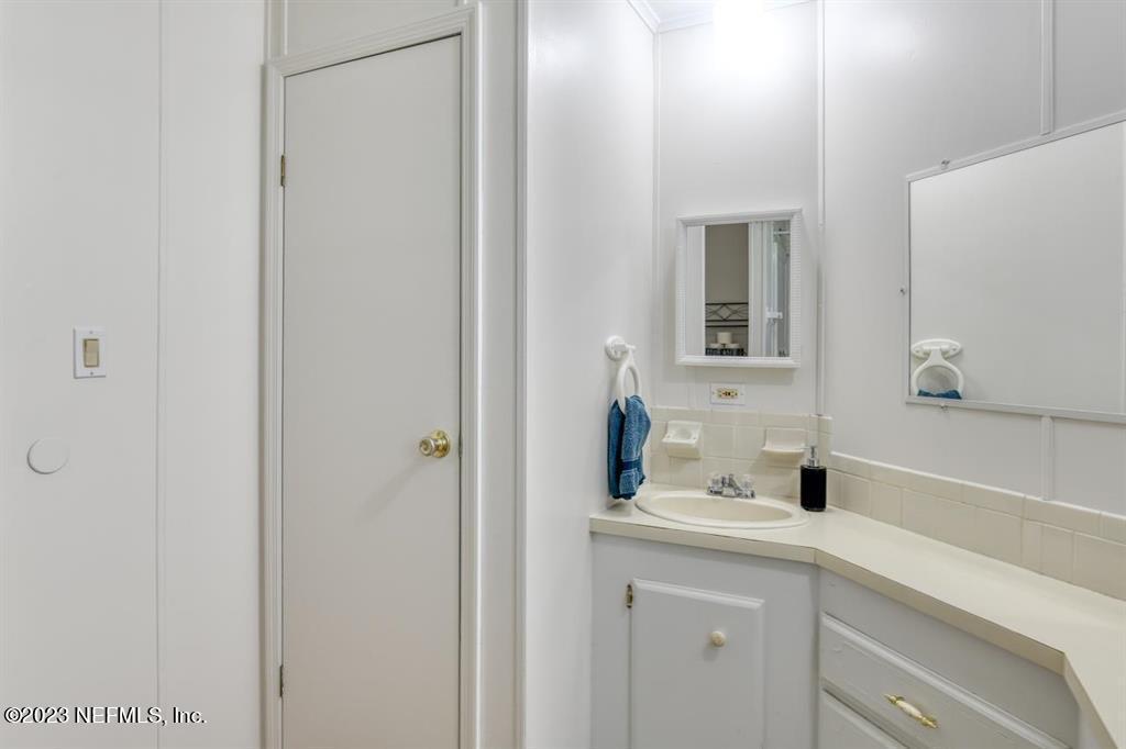 2221 Twin Fox Trail St. Augustine, FL 32086 - Photo 19 of 36 a bathroom with a sink and a mirror