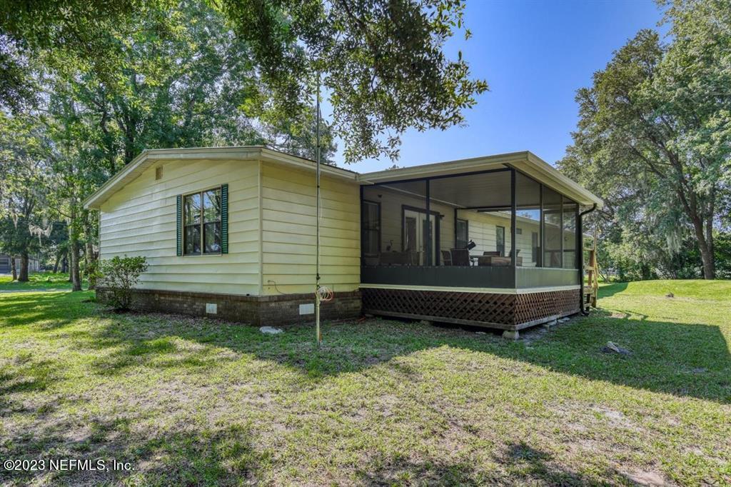 2221 Twin Fox Trail St. Augustine, FL 32086 - Photo 27 of 36 a view of a house with a yard