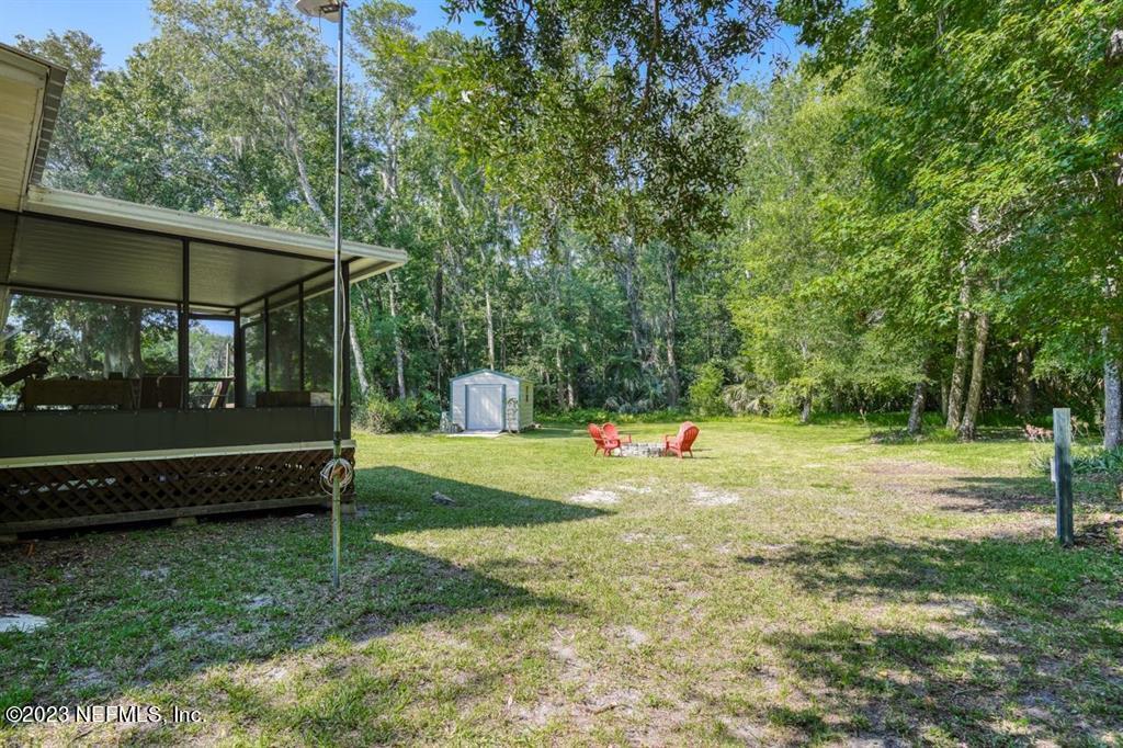 2221 Twin Fox Trail St. Augustine, FL 32086 - Photo 28 of 36 a view of a yard with a slide