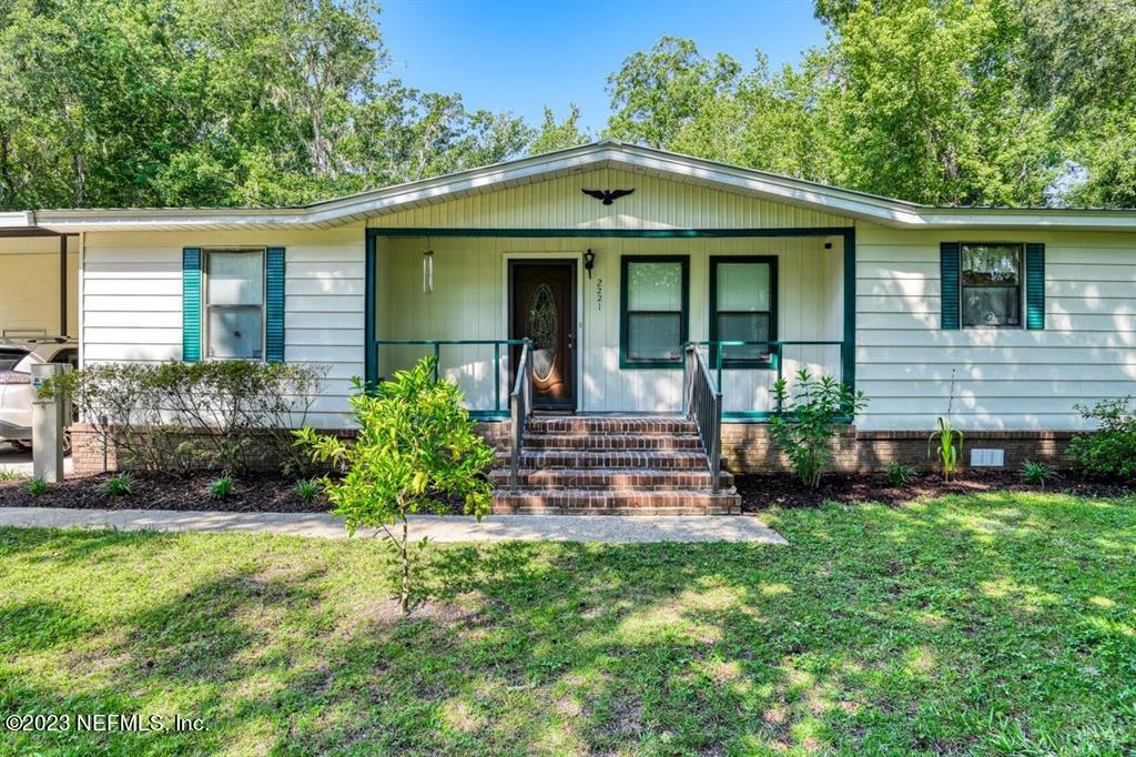 2221 Twin Fox Trail St. Augustine, FL 32086 - Photo 3 of 36 a front view of a house with a yard
