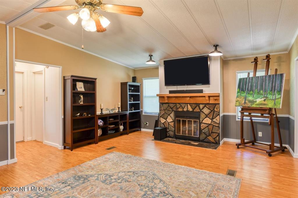 2221 Twin Fox Trail St. Augustine, FL 32086 - Photo 9 of 36 a living room with furniture and a flat screen tv