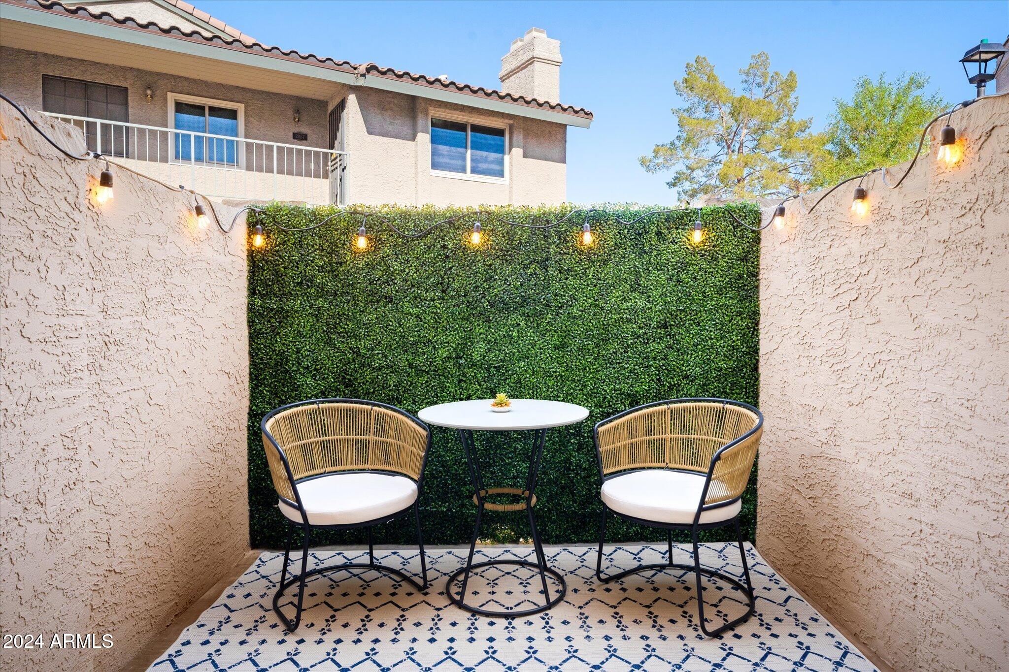 533 West Guadalupe Road, Unit 1063 Mesa, AZ 85210 - Photo 11 of 57 a backyard of a house with table and chairs