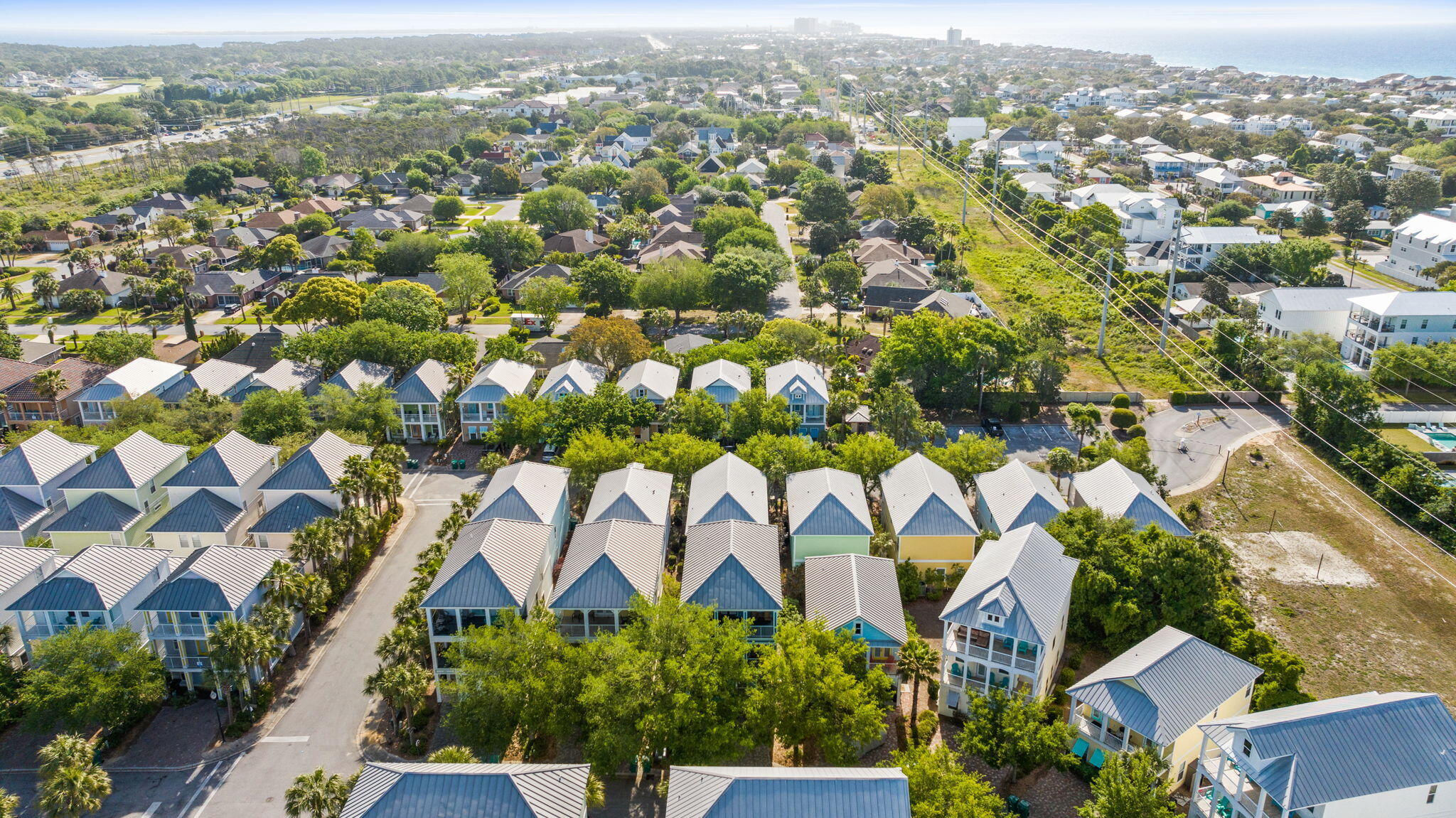 209 Grand Key Loop East Destin, FL 32541 - Photo 53 of 59 an aerial view of residential houses with outdoor space and parking