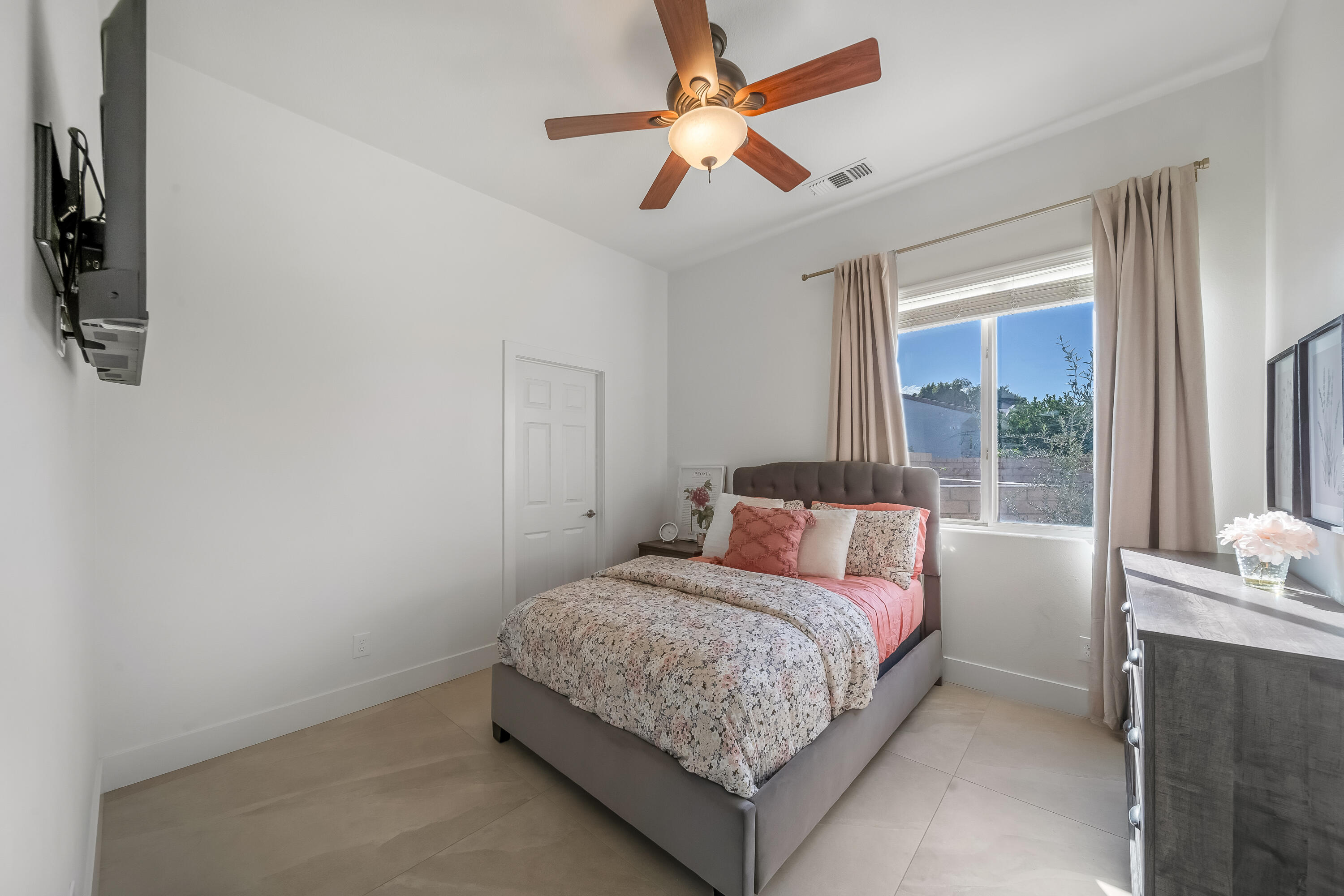 80262 Amazon Avenue Indio, CA 92201 - Photo 35 of 69 a bedroom with a bed and a large window