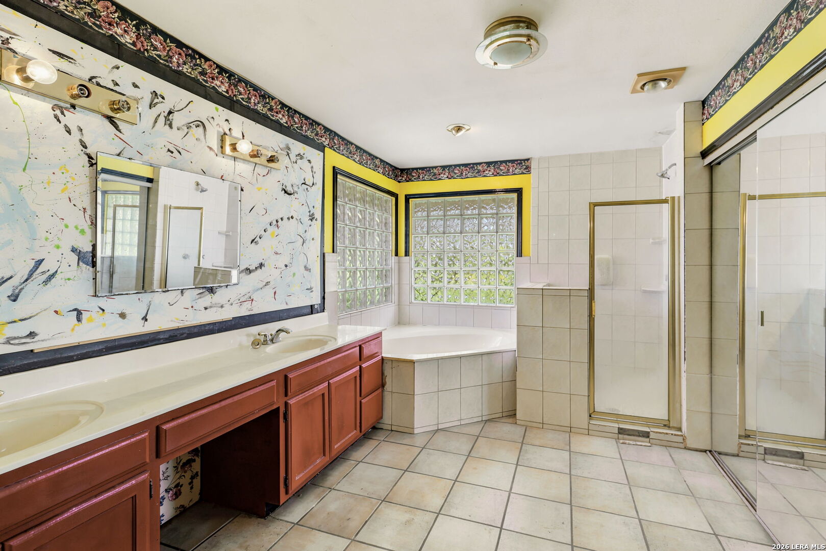 3061 Horse Ranch Road San Antonio, TX 78264 - Photo 21 of 34 a bathroom with a sink a large mirror and a bathtub