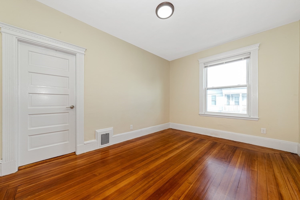 44 Brackett Street, Unit 3 Boston, MA 02135 - Photo 17 of 27 a view of a room with wooden floors and window