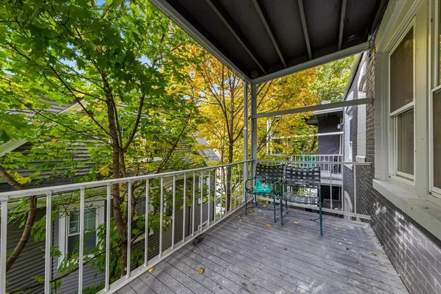 a view of balcony with furniture and wooden deck