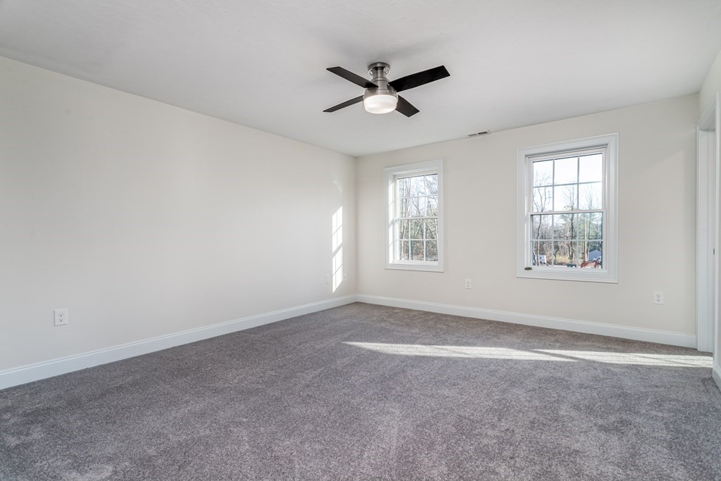 512 Northfield Road Lunenburg, MA 01462 - Photo 19 of 33 a view of a livingroom with a ceiling fan and window