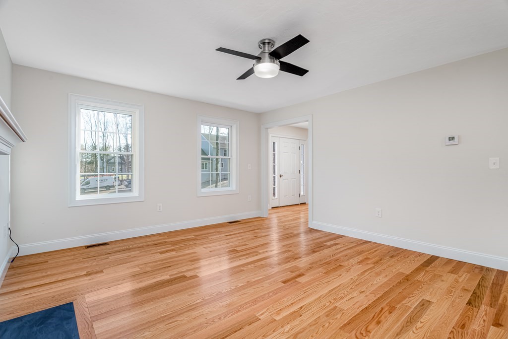 512 Northfield Road Lunenburg, MA 01462 - Photo 5 of 33 a view of empty room with wooden floor and fan