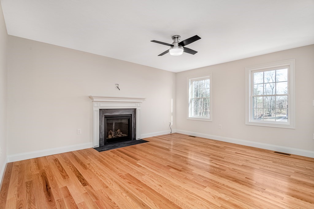 512 Northfield Road Lunenburg, MA 01462 - Photo 6 of 33 a view of an empty room with wooden floor and a window