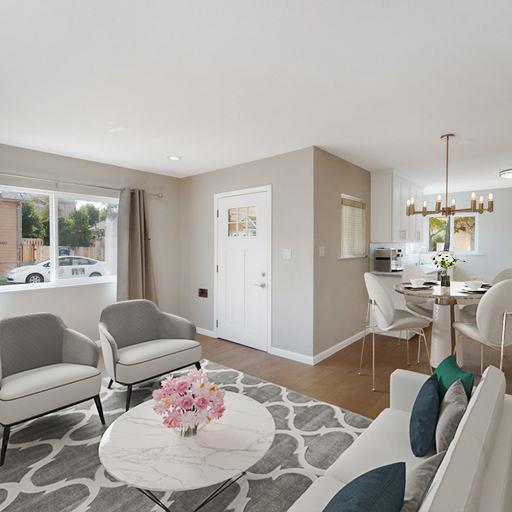a living room with furniture and a table
