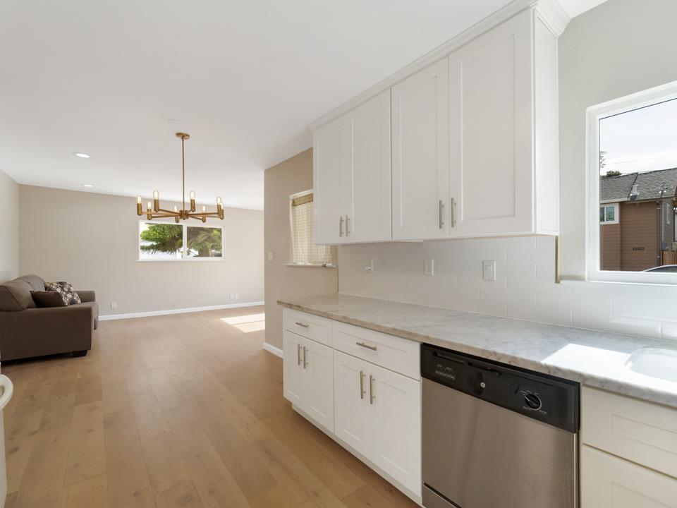 22824 High Street Hayward, CA 94541 - Photo 12 of 23 a kitchen with granite countertop white cabinets and window