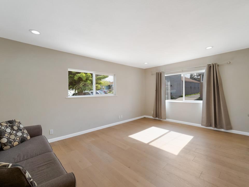 22824 High Street Hayward, CA 94541 - Photo 13 of 23 a living room with a couch and a window