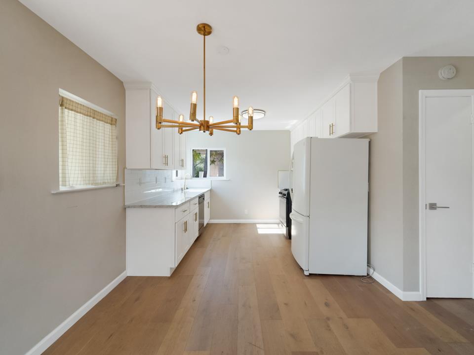 22824 High Street Hayward, CA 94541 - Photo 8 of 23 a kitchen with white cabinets and white appliances