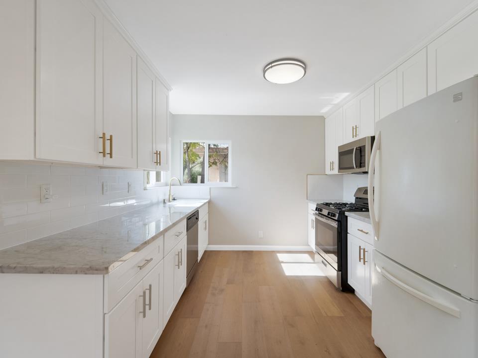22824 High Street Hayward, CA 94541 - Photo 10 of 23 a kitchen with granite countertop a sink stove and refrigerator