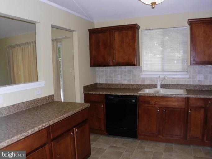 5511 Rolling Road Springfield, VA 22151 - Photo 3 of 17 a kitchen with a sink and a stove