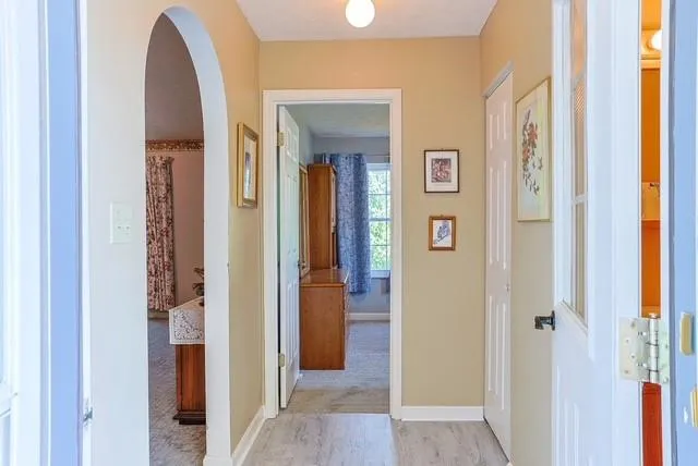 a view of a bathroom from a hallway