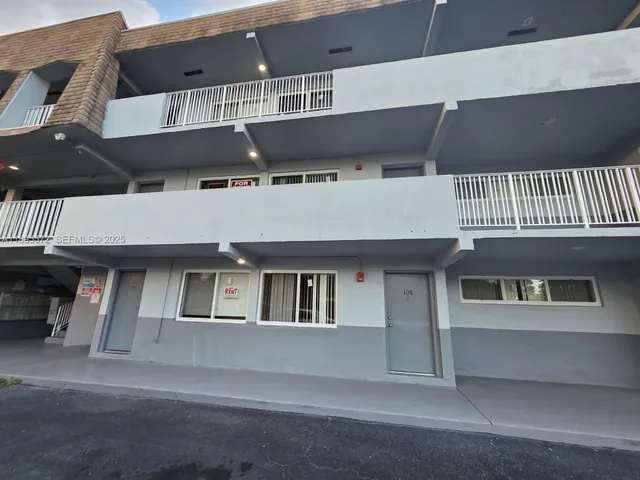 a front view of residential houses with stairs