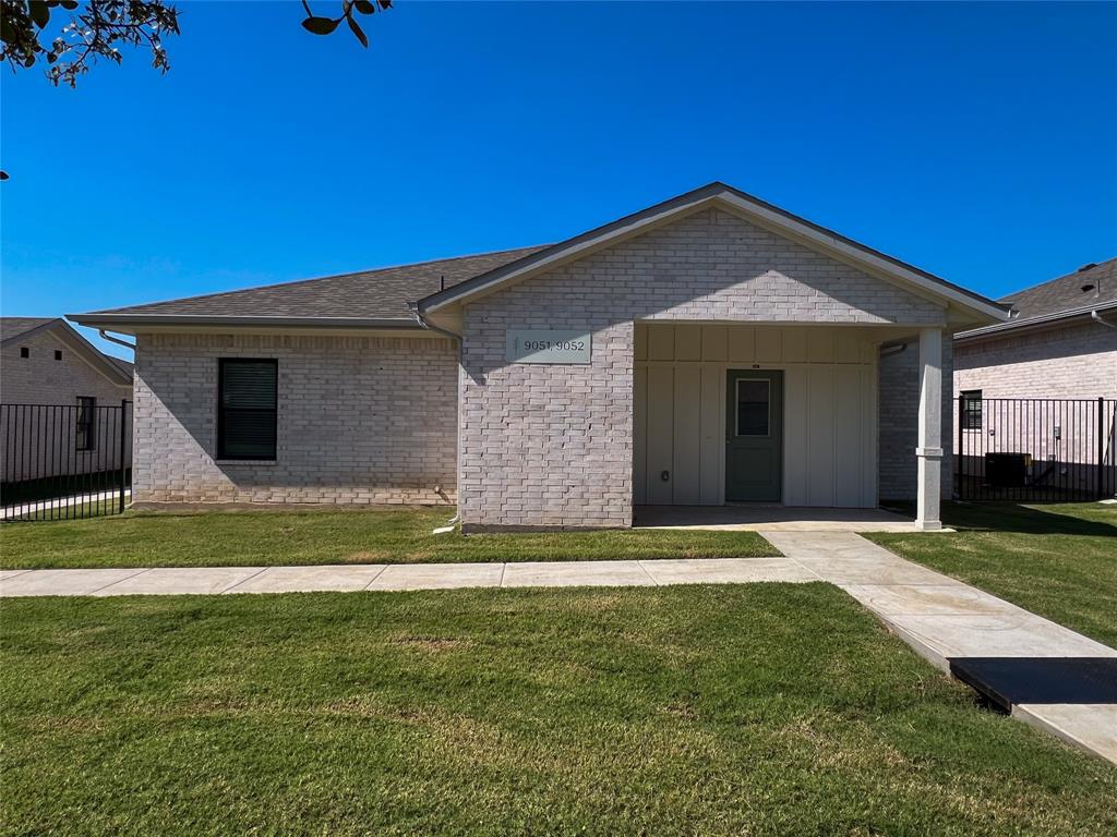 3050 Viking Street Denison, TX 75020 - Photo 2 of 17 a front view of a house with a yard