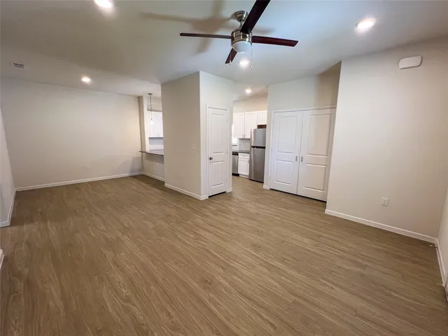 a kitchen with stainless steel appliances a refrigerator sink and cabinets