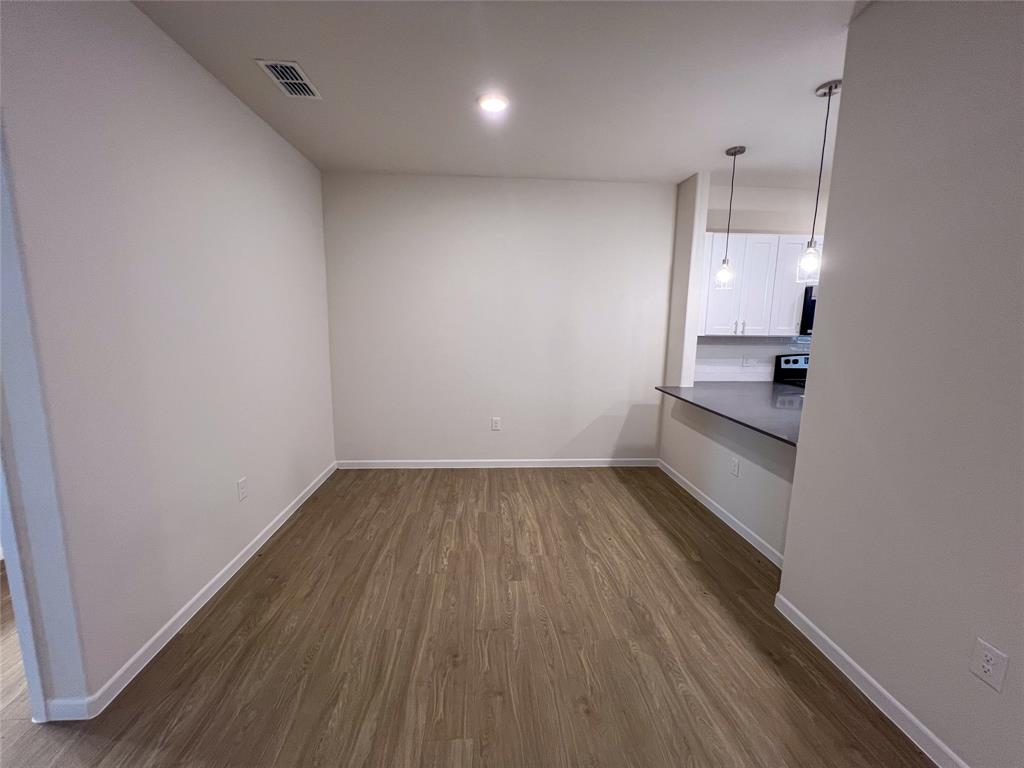 3050 Viking Street Denison, TX 75020 - Photo 8 of 17 a view of a room with wooden floor and window