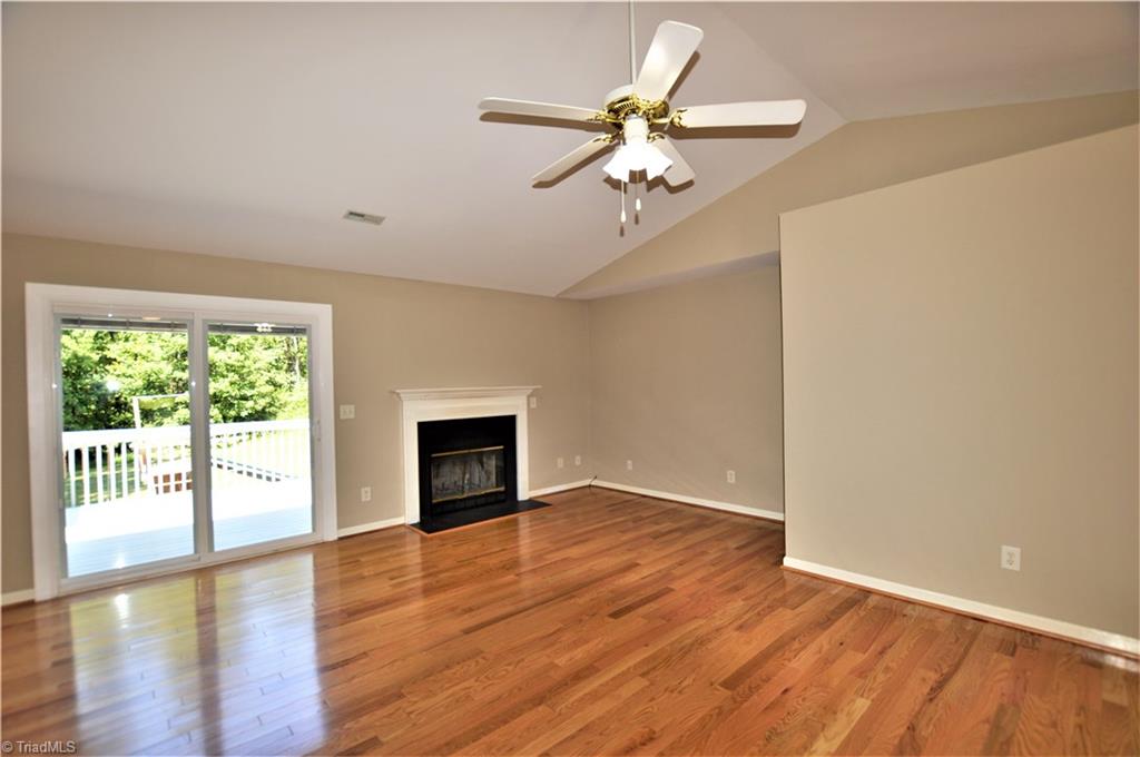 168 Running Cedar Road Madison, NC 27025 - Photo 3 of 30 Living room and doors to deck