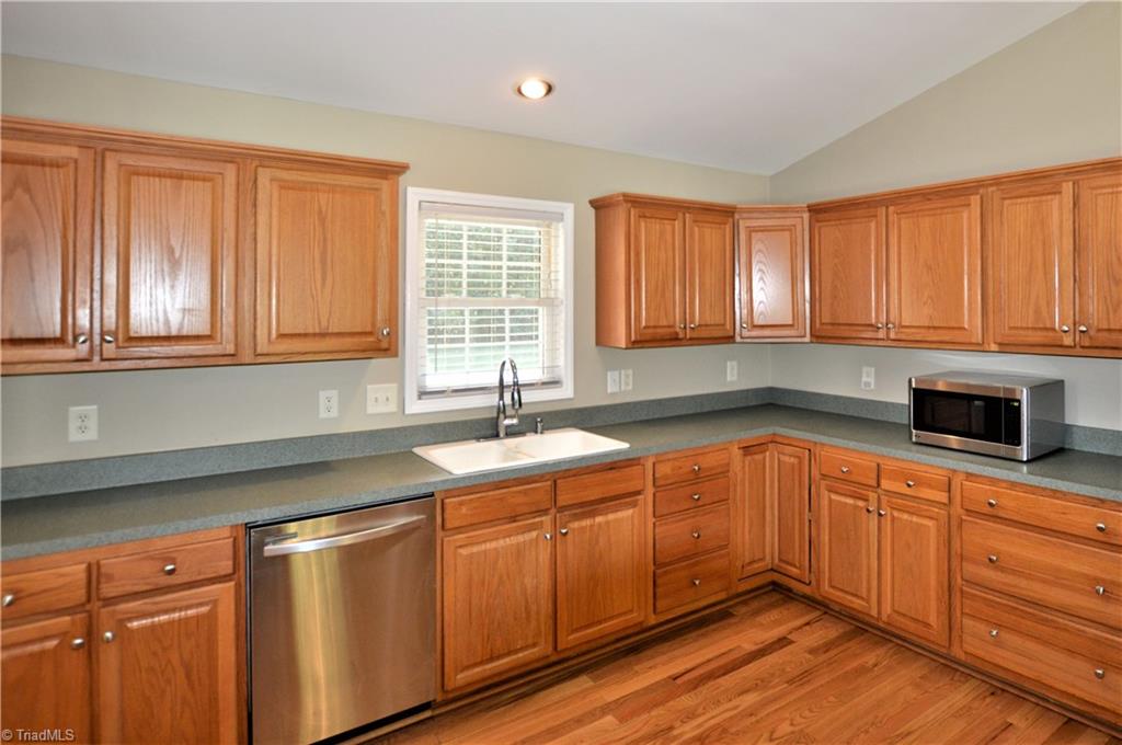 168 Running Cedar Road Madison, NC 27025 - Photo 7 of 30 Lots of cabinets and counter space in kitchen