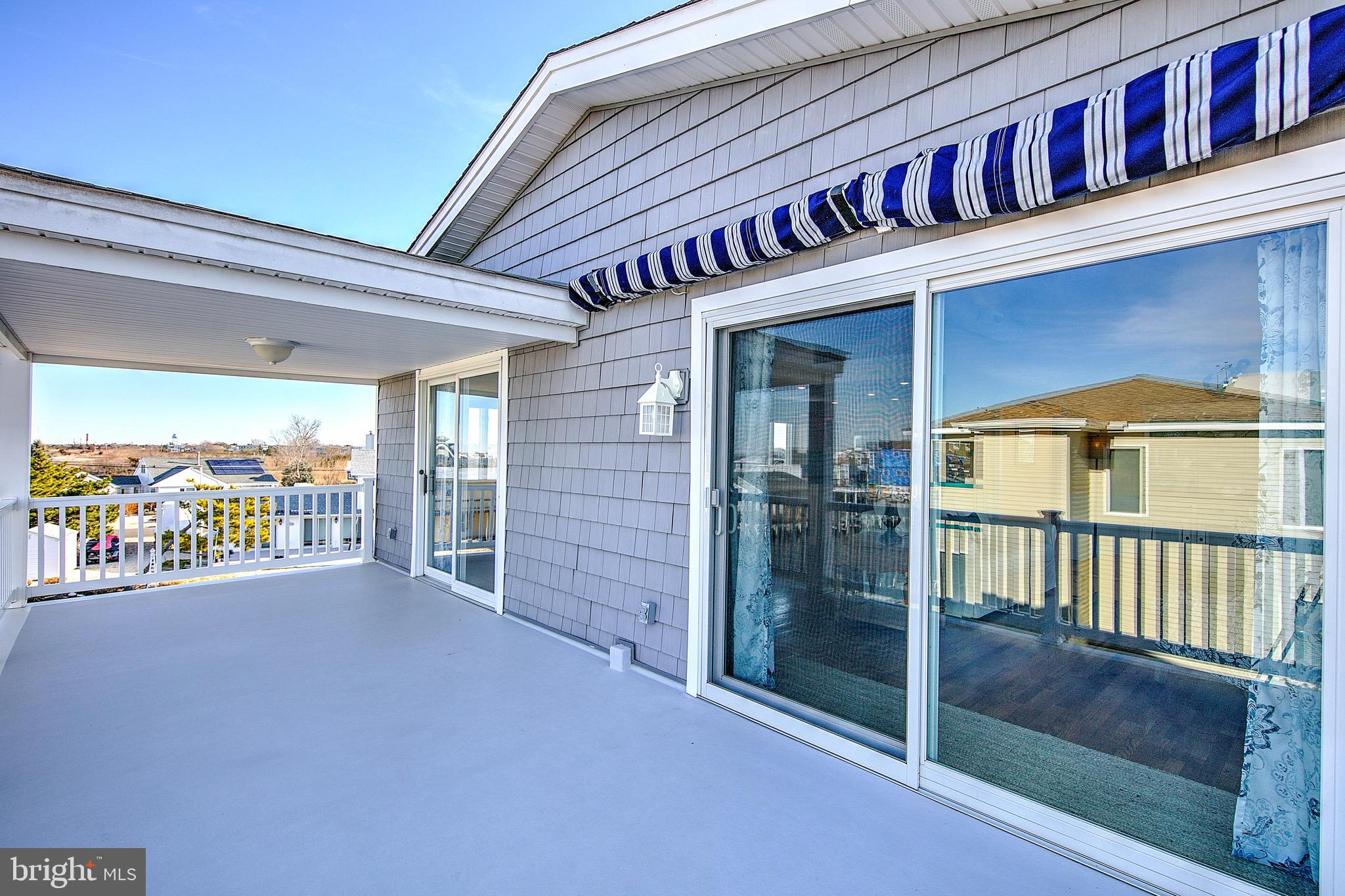 19 Cedar Drive Long Beach Township, NJ 08008 - Photo 23 of 69 Awning proves shade when needed.