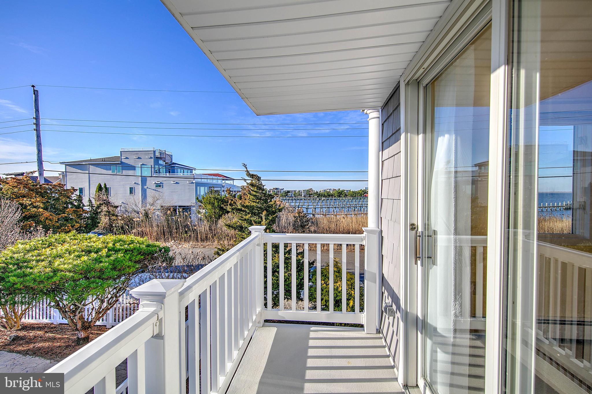 19 Cedar Drive Long Beach Township, NJ 08008 - Photo 39 of 69 Deck overlooking bay, lagoon and pool area.