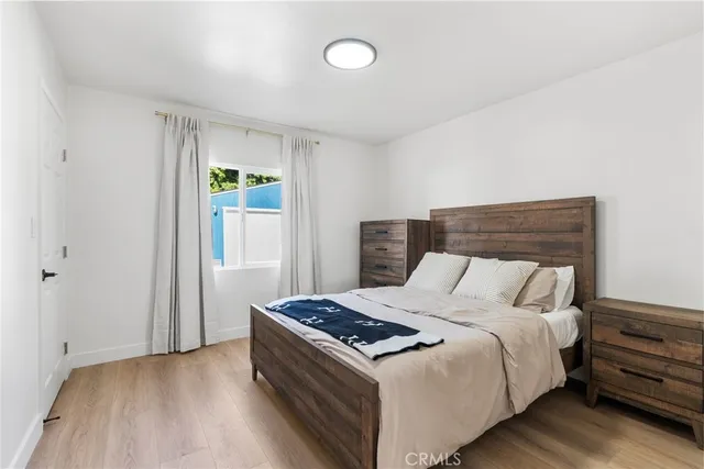 a bed room with a bed and a window