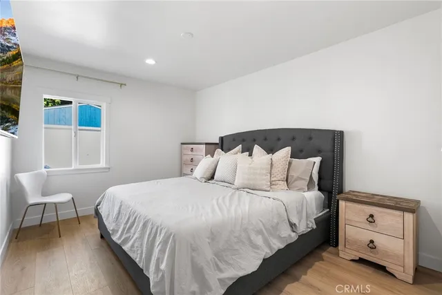 a bedroom with a bed and window