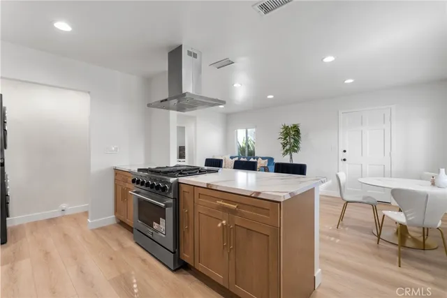 a kitchen with a stove and a table